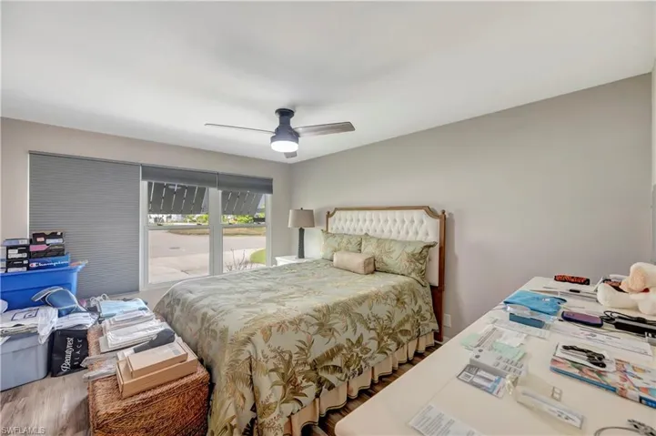 Bedroom with hardwood / wood-style flooring and ceiling fan