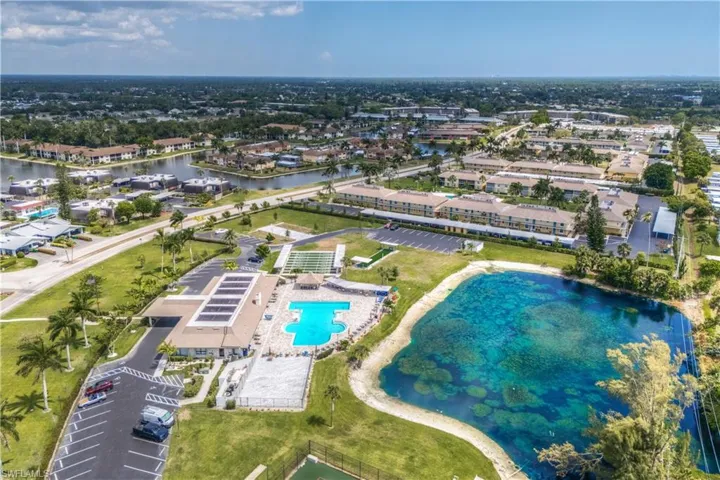 Clubhouse aerial view featuring a water view
