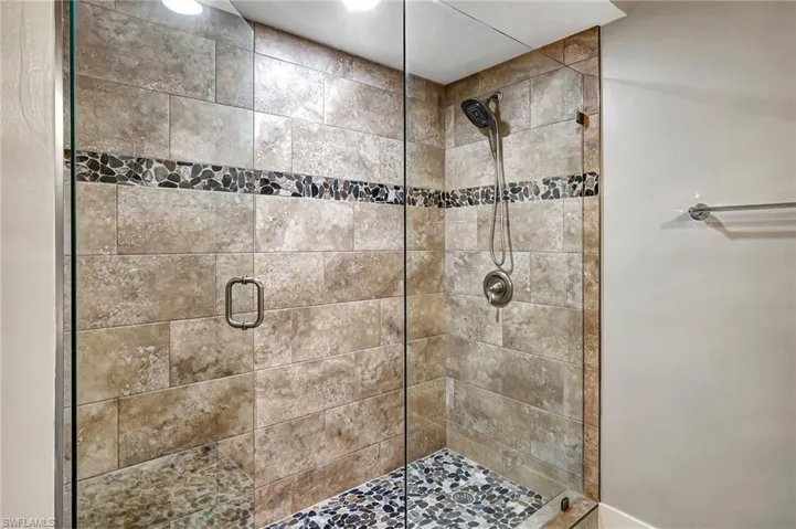 Guest bath walk in shower with frameless glass door