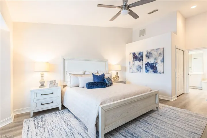 Bedroom featuring light wood-style flooring, a ceiling fan, and a closet