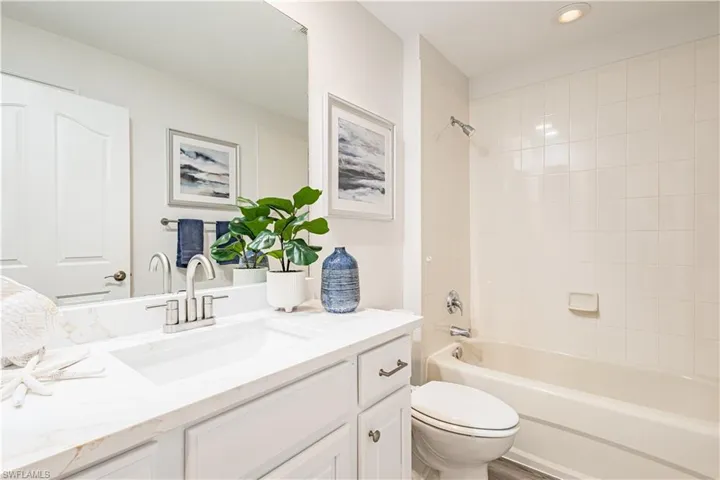 Bathroom featuring vanity and tub / shower combination