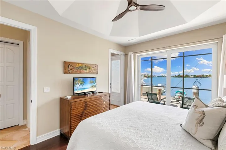 Elegant ceiling detailing, lanai access, and easy bathroom access