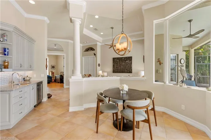 Sophisticated wet bar area with wine cooler and more cabinet space