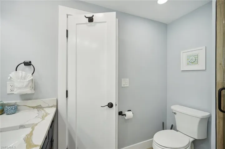 Bathroom with vanity and recessed lighting