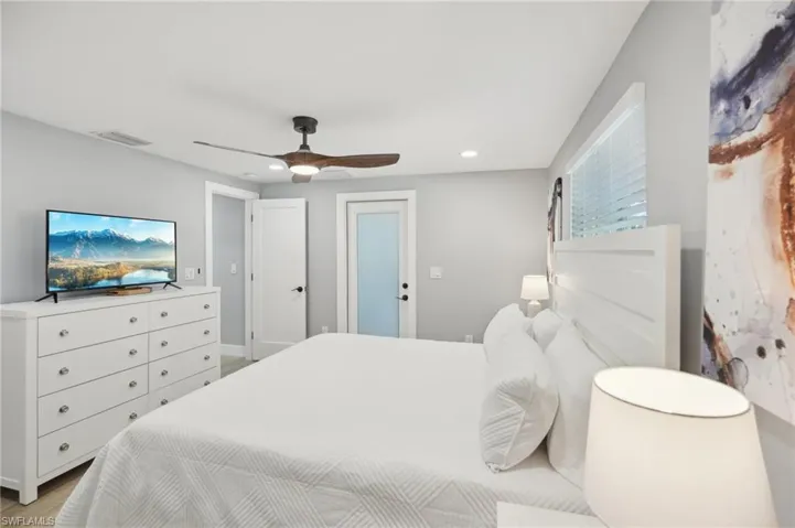 Bedroom with ceiling fan, recessed lighting, and light wood-style floors