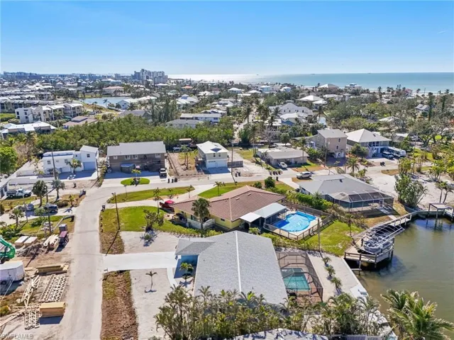 Aerial view of a nearby body of water and a pool