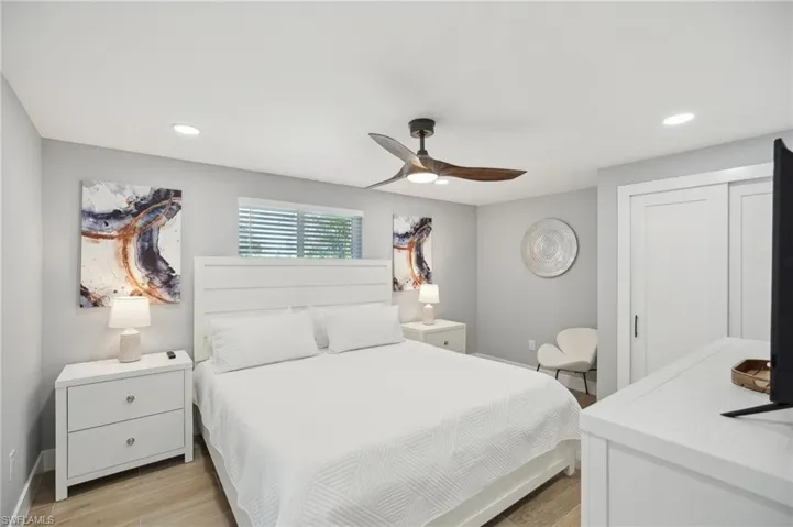 Bedroom featuring recessed lighting, light wood-type flooring, and a ceiling fan