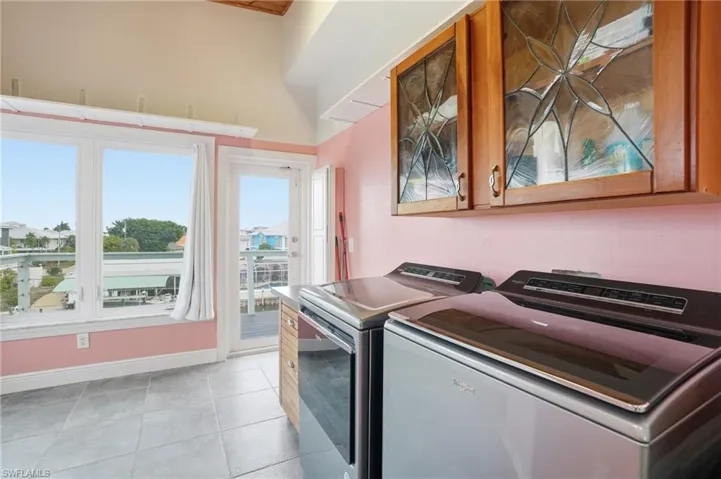 Laundry room with separate washer and dryer- virtually enhanced