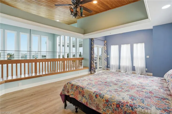 Primary bedroom featuring recessed lighting,  a ceiling fan, and wooden ceiling - virtually enhanced