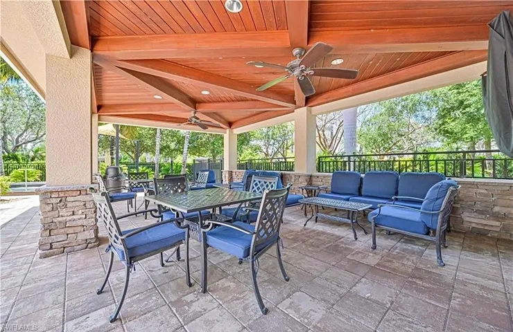 View of patio with ceiling fan and outdoor lounge area