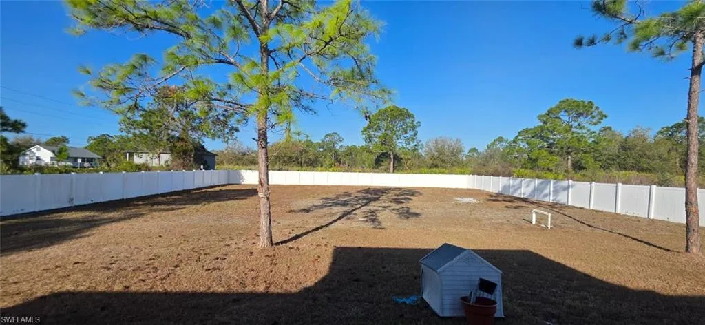 View of property's community featuring a fenced backyard