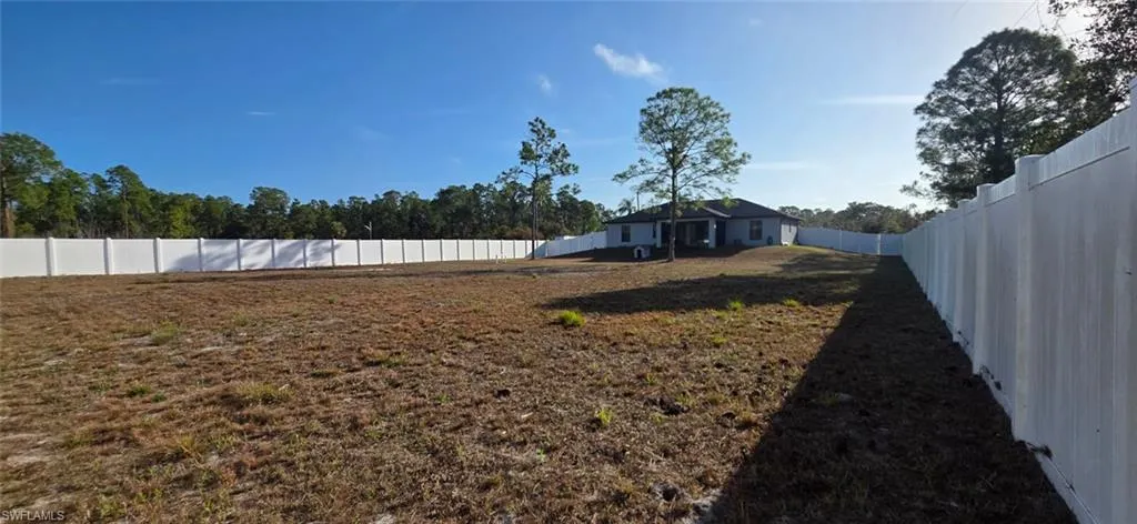 View of fenced backyard