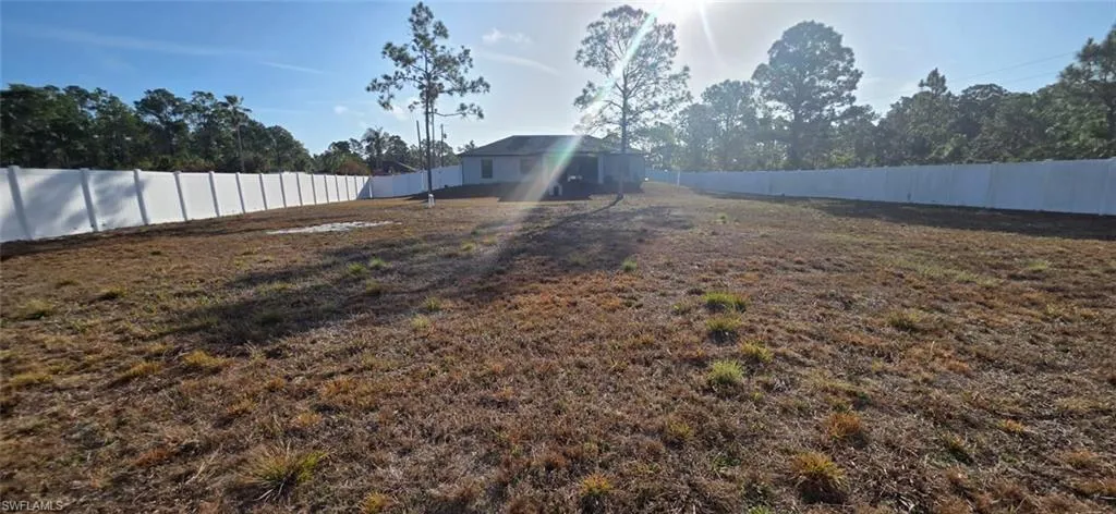 View of fenced backyard