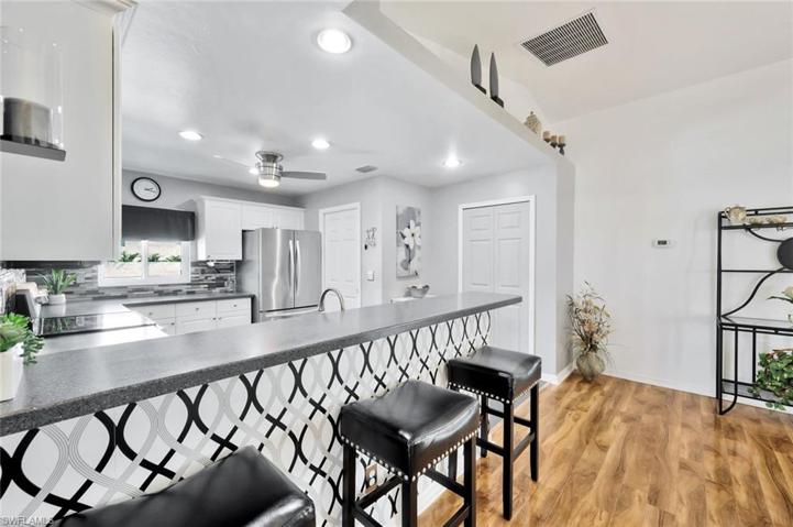 View of Brakfast Bar and Bar Stools to Pantry Bifold