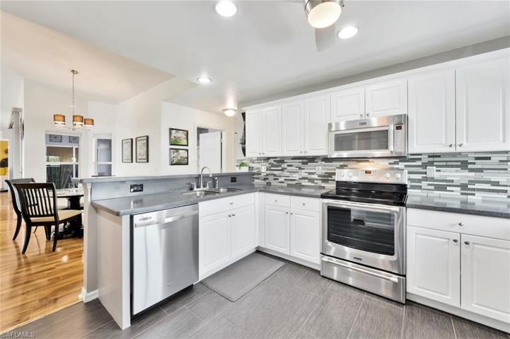 View of Efficient Kitchen Crown Molding Cabinetry and Double Sink Counter