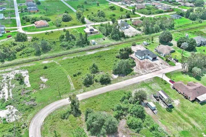 Aerial view of property and surrounding area featuring rural landscape