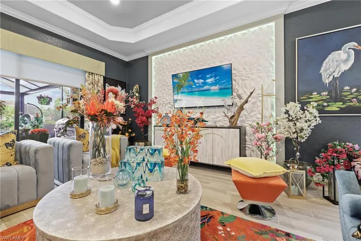 Dining space with tiled floors and ornamental molding