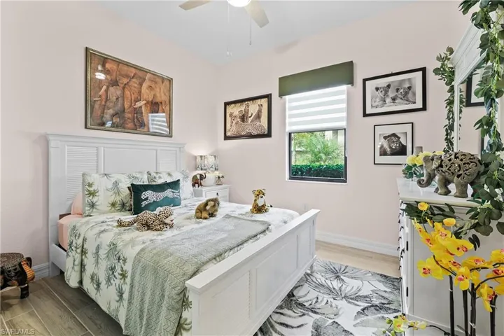 Entrance foyer featuring tiled floors, ornamental molding, a textured wall, and a chandelier