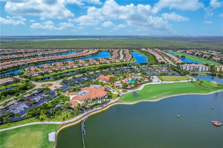 Aerial view of Residential area featuring a golf club and a nearby body of water