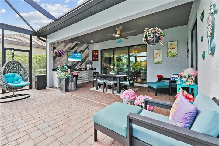 View of patio / terrace with a ceiling fan, an outdoor hangout area, a sunroom, and screen enclosure
