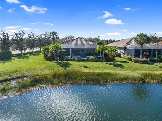 Back of home with lake view