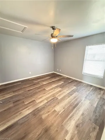 bedroom featuring a ceiling fan and light laminate flooring