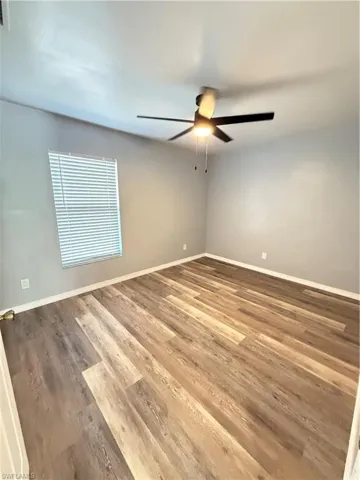 bedroom featuring laminate finished floors and ceiling fan