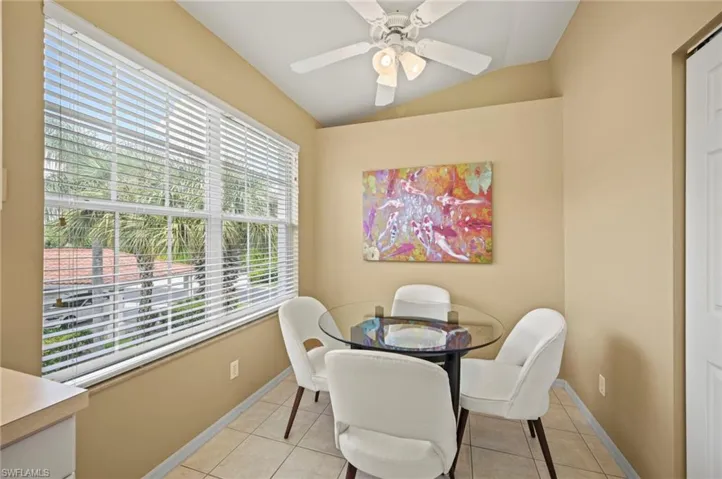Tiled dining space with ceiling fan