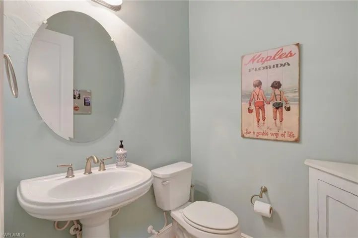 Half bathroom featuring a sink and toilet