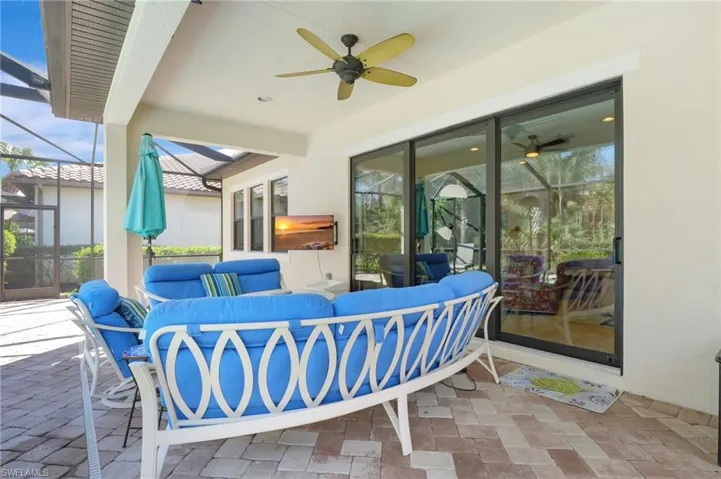 View of patio with an outdoor hangout area, a lanai, and a ceiling fan