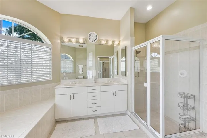 Dual sinks & a tiled walk in shower