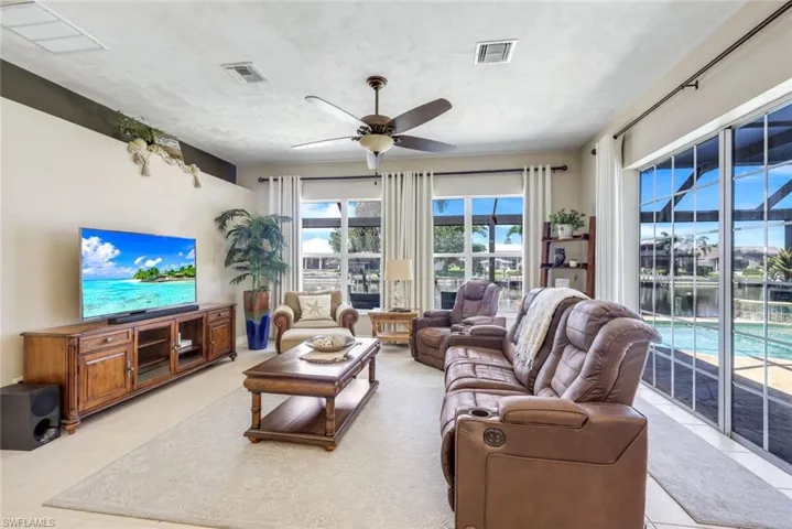 Large windows overlooking the pool area & your 175 ft canal