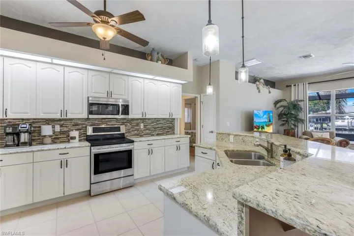 Gourmet kitchen with granite countertops & wood cabinets