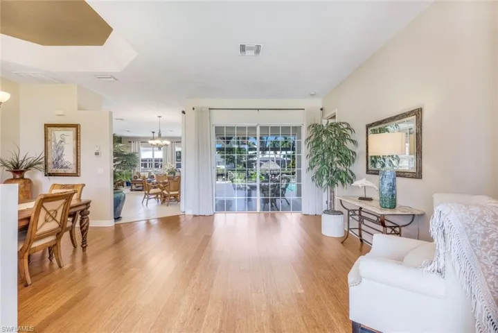 Formal living/dining area with bamboo floors & sliders that open up to your patio