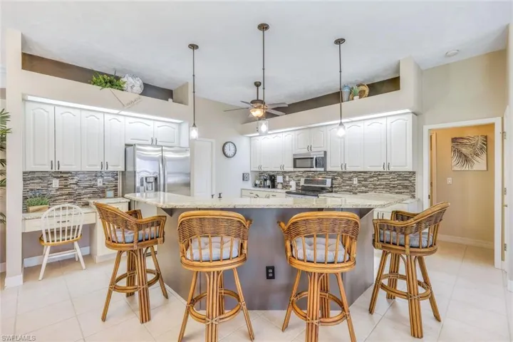 Breakfast bar & plenty of cabinets in your kitchen
