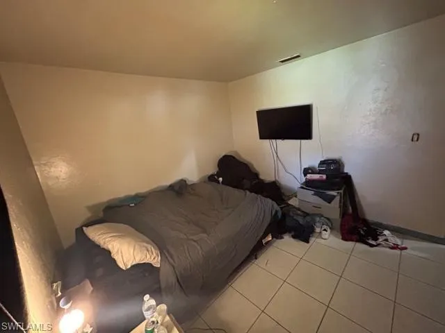 Bedroom featuring light tile patterned floors