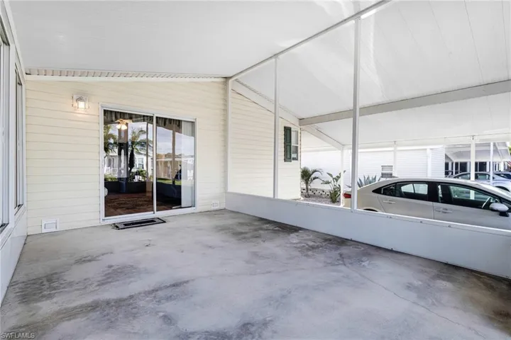 View of patio / terrace with a carport