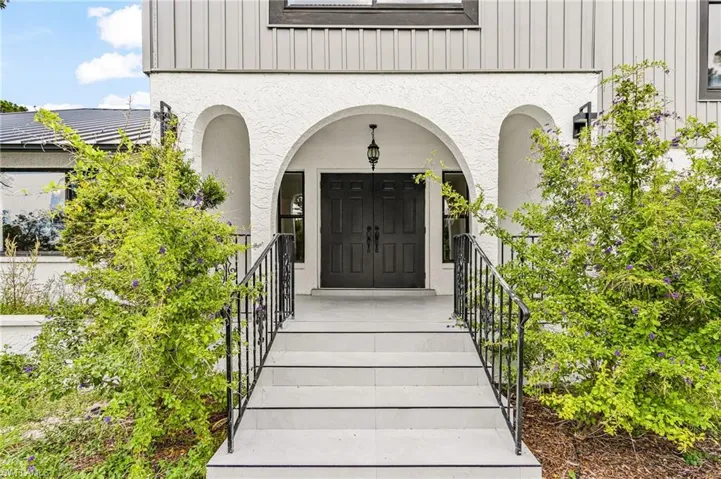 double french doors, tiles porch and stairs