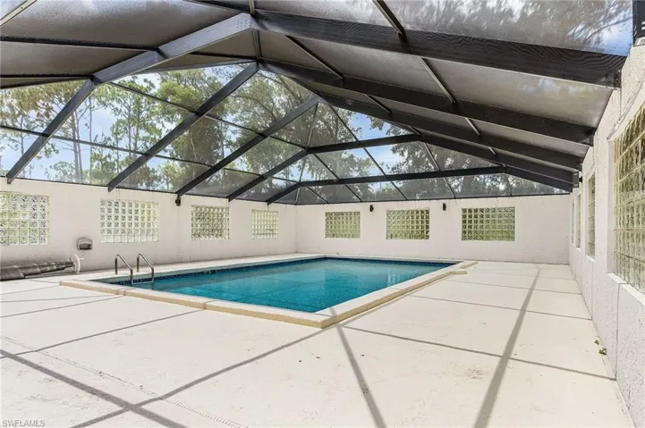 Very large enclosed pool, plenty of space for lounge chairs. Per county records, pool is 18'x31' - per county enclosure is 55' x 38'
