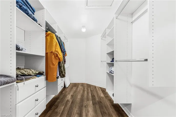 Primary Bedroom 2 Closet approx 15' x 6'6" with built-in, attic access pull-down stairs