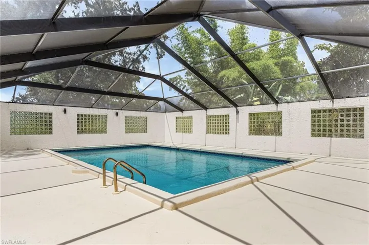 Very large enclosed pool, plenty of space for lounge chairs. Per county records, pool is 18'x31' - per county enclosure is 55' x 38'