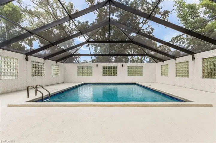 Very large enclosed pool, plenty of space for lounge chairs. Per county records, pool is 18'x31' - per county enclosure is 55' x 38'