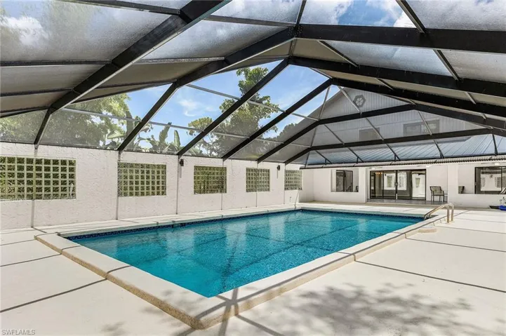 Very large enclosed pool, plenty of space for lounge chairs. Per county records, pool is 18'x31' - per county enclosure is 55' x 38'