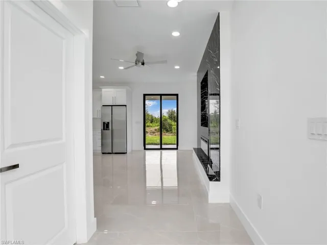 Hall featuring visible vents, recessed lighting, baseboards, and marble finish floor