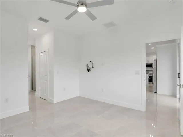 Spare room with recessed lighting, visible vents, ceiling fan, and baseboards