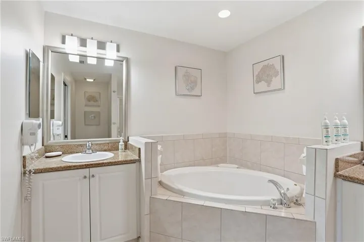 ENSUITE SPA BATH WITH SOAKING TUB AND DUAL SINKS..