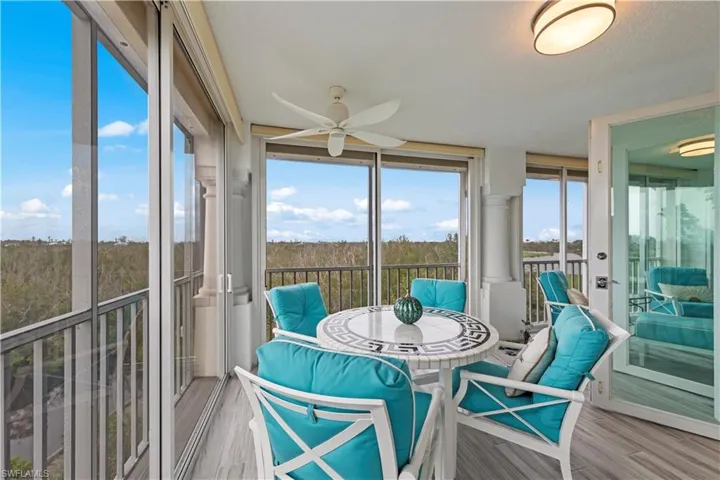Sunroom featuring ceiling fan