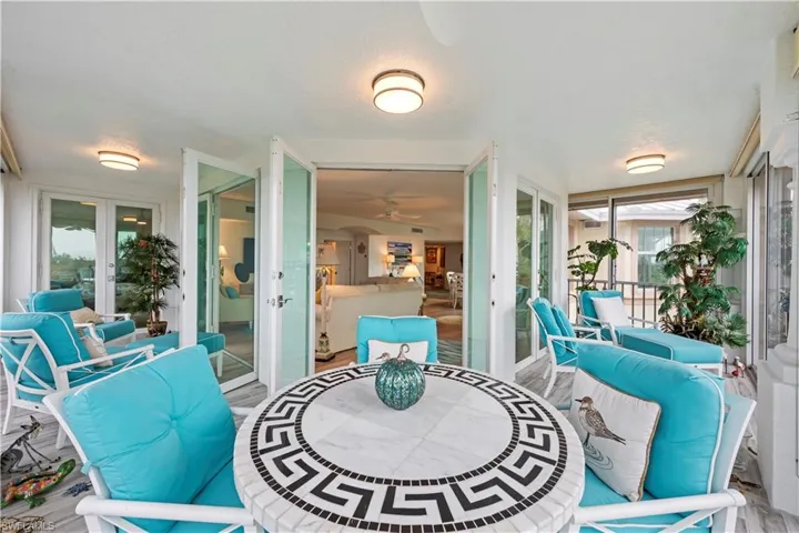 Sunroom / solarium featuring french doors