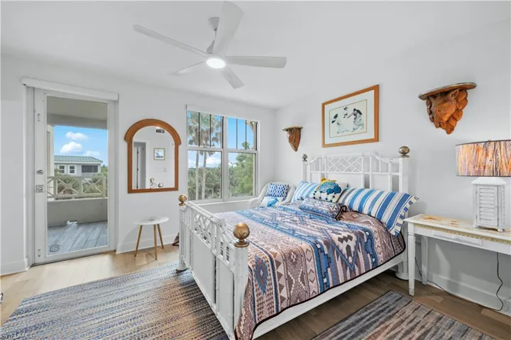 Bedroom featuring ceiling fan and hardwood / wood-style floors