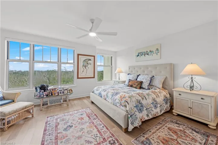 Bedroom featuring hardwood / wood-style floors and ceiling fan